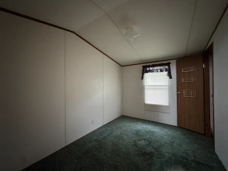 Second bedroom with window and closet