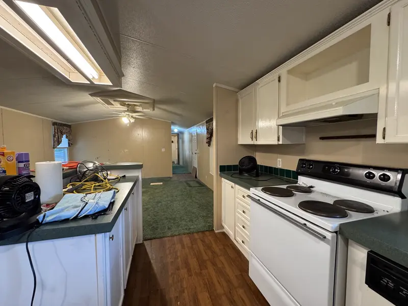 Kitchen with stove and cabinets