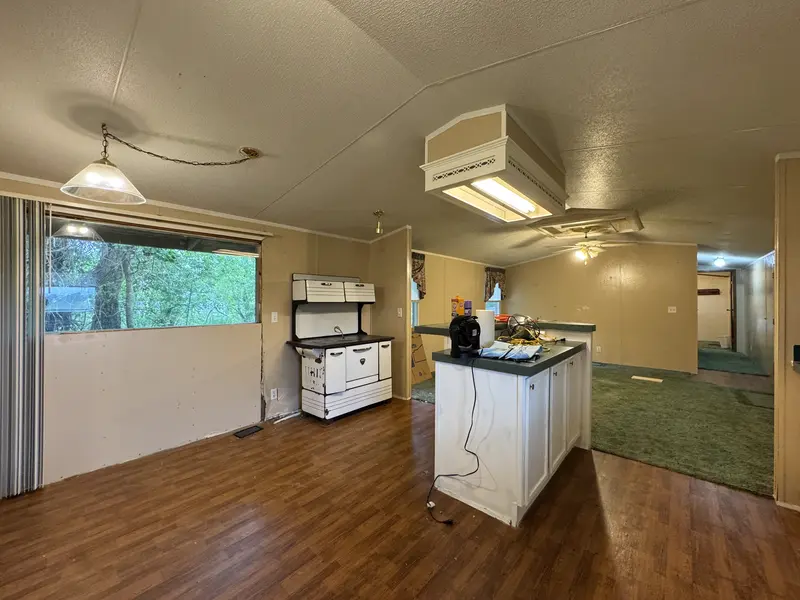 Dining area with pendant light and picture window