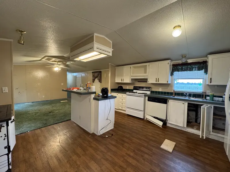 Kitchen with breakfast bar and appliances
